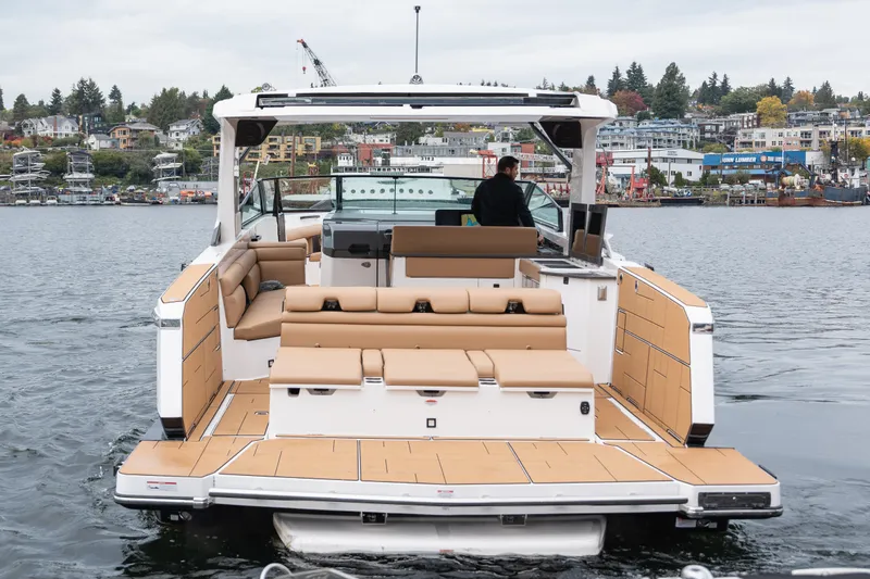  Yacht Photos Pics 2024 Aviara AV40 I/O luxury boat on water, featuring spacious deck and modern design.