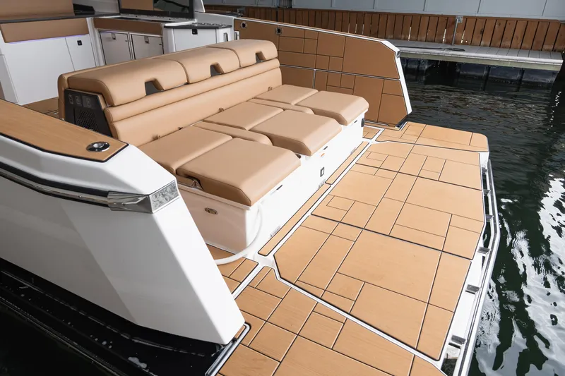  Yacht Photos Pics 2024 Aviara AV40 I/O boat with tan seating and spacious deck by the water.