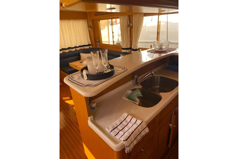  Yacht Photos Pics Luxurious interior of 2005 Selene 47 yacht with elegant kitchen and dining area.