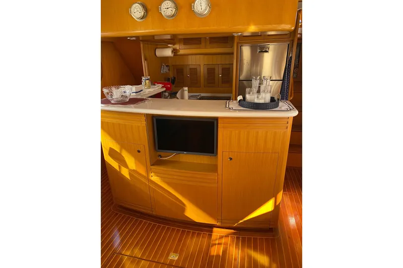  Yacht Photos Pics Luxurious interior of 2005 Selene 47 yacht with wooden cabinetry and modern amenities.