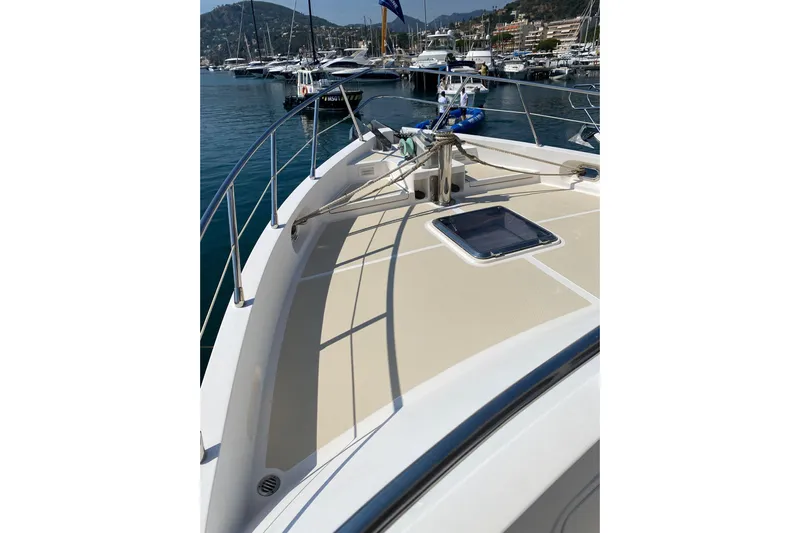  Yacht Photos Pics 2005 Selene 47 yacht deck with marina view, featuring sleek design and modern amenities.