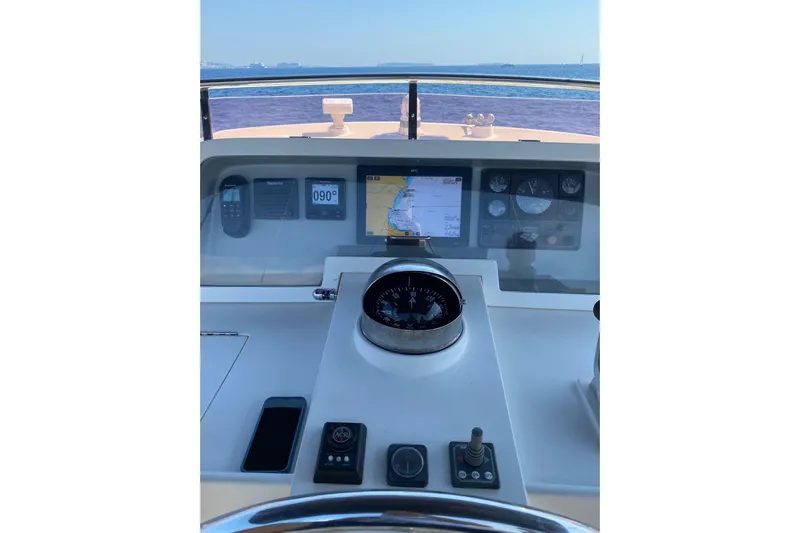  Yacht Photos Pics Helm of 2005 Selene 47 yacht with navigation instruments and sea view.