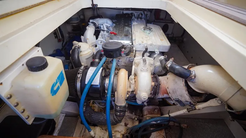 Gyspy Baby Yacht Photos Pics Engine compartment of a 2007 Legacy 32 boat, showcasing mechanical components and hoses.