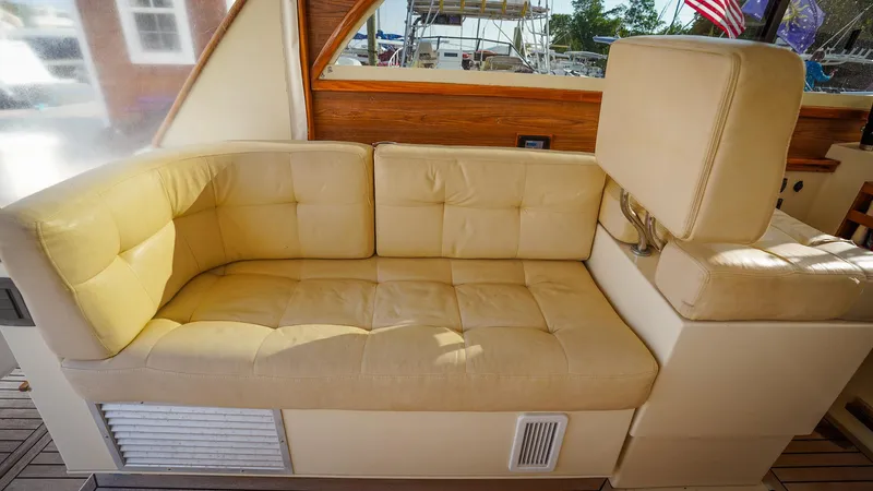 Gyspy Baby Yacht Photos Pics Beige cushioned seating on 2007 Legacy 32 boat interior.
