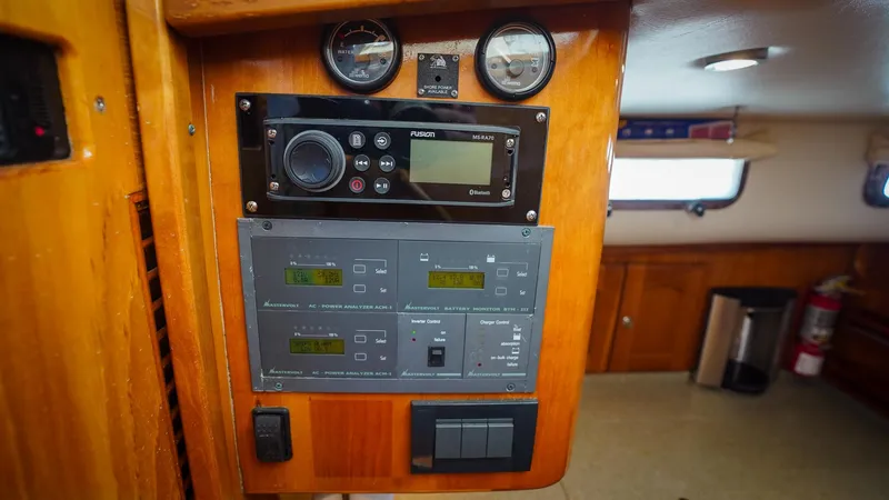 Gyspy Baby Yacht Photos Pics Control panel inside 2007 Legacy 32 boat cabin with navigation and monitoring systems.
