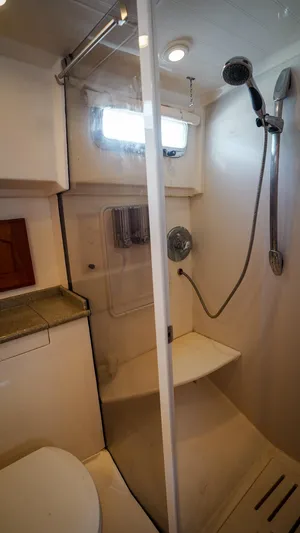 Gyspy Baby Yacht Photos Pics Compact bathroom with shower in 2007 Legacy 32 boat.