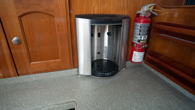 Gyspy Baby Yacht Photos Pics Boat interior with fire extinguisher and stainless steel appliance, Legacy 32, 2007 model.