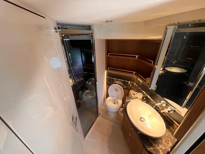  Yacht Photos Pics Luxurious bathroom in 2018 Absolute 52 Navetta yacht with modern fixtures and elegant design.