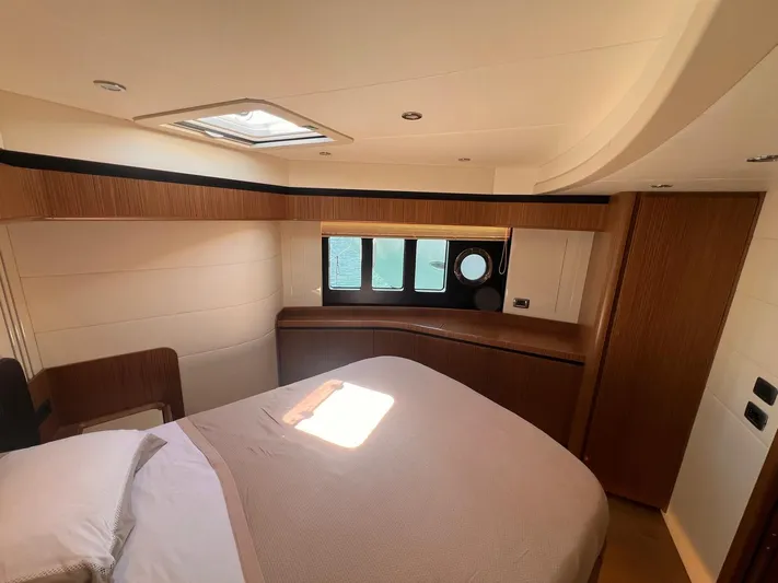  Yacht Photos Pics Luxurious bedroom interior of 2018 Absolute 52 Navetta yacht with modern design and natural light.