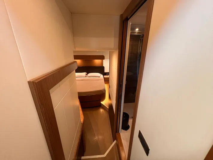  Yacht Photos Pics Interior of 2018 Absolute 52 Navetta yacht, featuring a cozy bedroom.