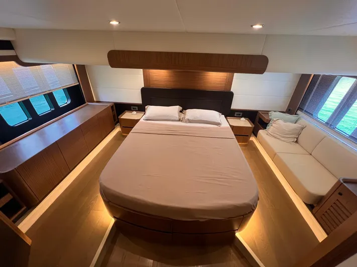  Yacht Photos Pics Luxurious bedroom interior of 2018 Absolute 52 Navetta yacht with modern design and cozy ambiance.