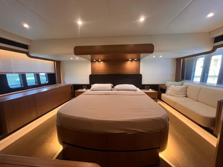  Yacht Photos Pics Luxurious bedroom interior of 2018 Absolute 52 Navetta yacht with modern design and ambient lighting.