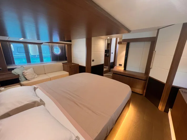  Yacht Photos Pics Luxurious bedroom interior of 2018 Absolute 52 Navetta yacht with modern design and cozy ambiance.