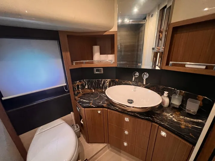  Yacht Photos Pics Luxurious bathroom in 2018 Absolute 52 Navetta yacht with marble countertop and modern fixtures.