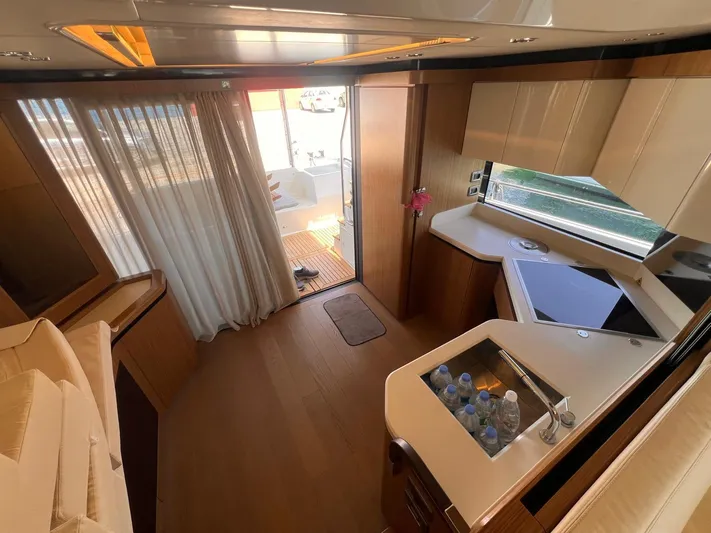  Yacht Photos Pics Luxurious interior of 2018 Absolute 52 Navetta yacht with modern kitchen and elegant design.