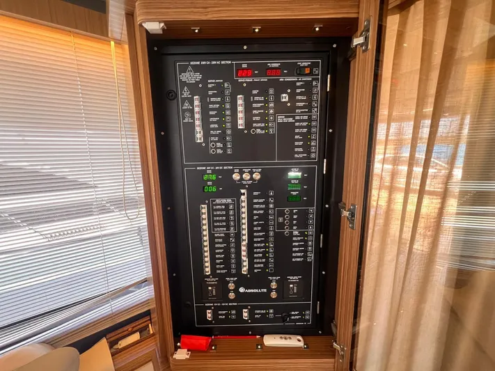  Yacht Photos Pics Electrical control panel inside 2018 Absolute 52 Navetta yacht, featuring switches and indicators.
