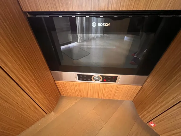  Yacht Photos Pics Bosch microwave in Absolute 52 Navetta yacht, 2018 model, with wooden cabinetry.