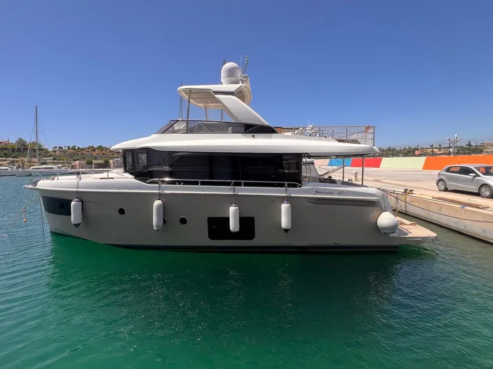 Yacht Photos Pics 2018 Absolute 52 Navetta yacht docked in a sunny marina.