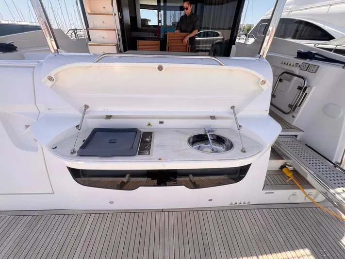  Yacht Photos Pics Outdoor kitchen on 2018 Absolute 52 Navetta yacht with grill and sink.