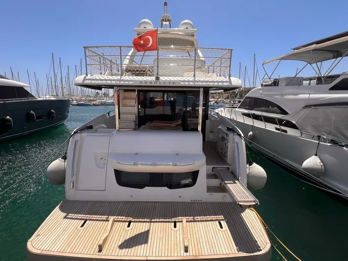 Yacht Photos Pics Luxury yacht Absolute 52 Navetta 2018 docked in marina, featuring Turkish flag.