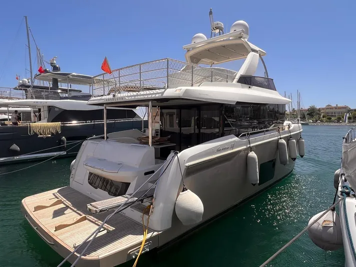  Yacht Photos Pics Luxury yacht Absolute 52 Navetta 2018 docked in marina under clear blue sky.