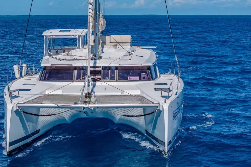 Happy Here Yacht Photos Pics 2020 Fountaine Pajot Saona 47 catamaran sailing on open blue sea.