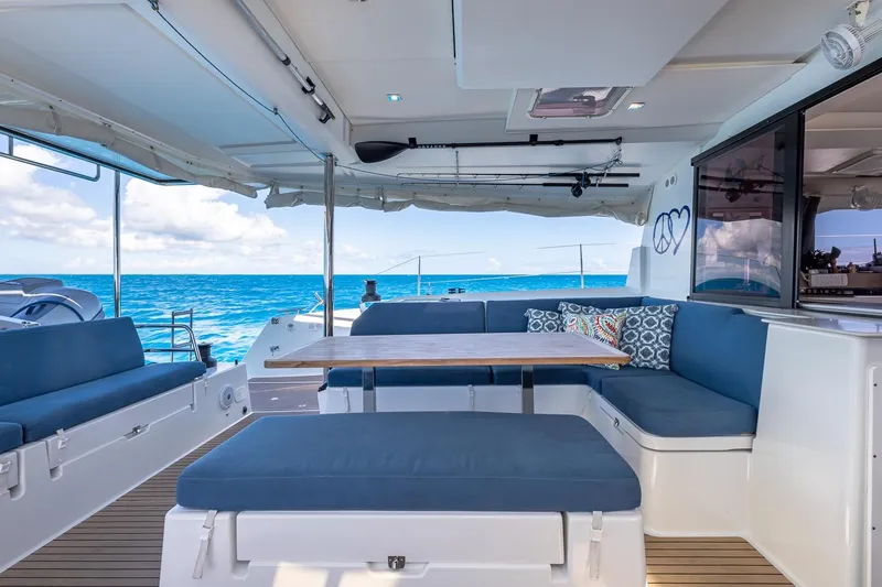 Happy Here Yacht Photos Pics Spacious deck of 2020 Fountaine Pajot Saona 47 catamaran with ocean view.