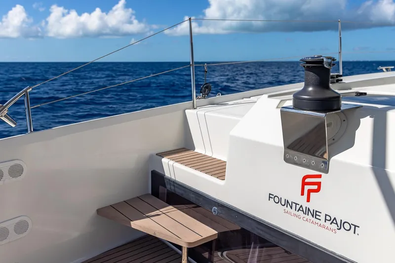 Happy Here Yacht Photos Pics 2020 Fountaine Pajot Saona 47 catamaran deck with ocean view and clear skies.