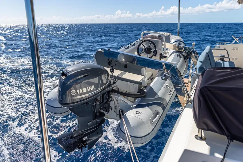 Happy Here Yacht Photos Pics Fountaine Pajot Saona 47 yacht with Yamaha motor and inflatable boat on open sea, 2020 model.