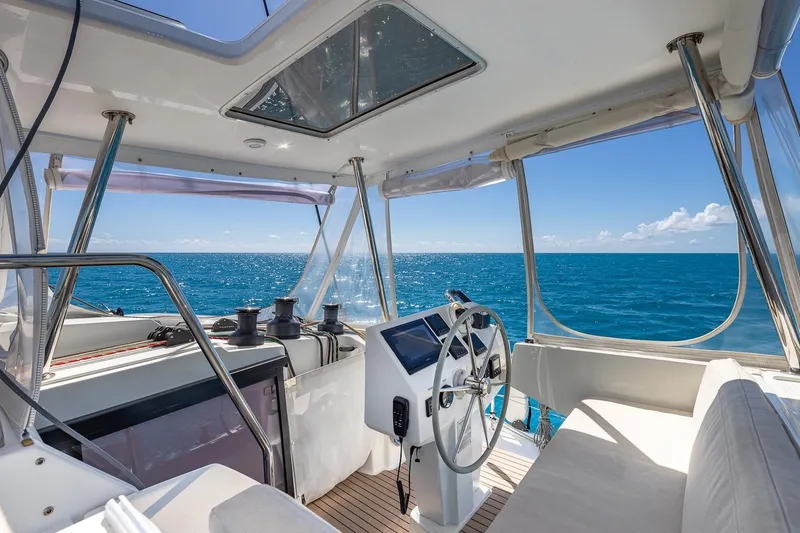 Happy Here Yacht Photos Pics Cockpit of 2020 Fountaine Pajot Saona 47 catamaran with ocean view.