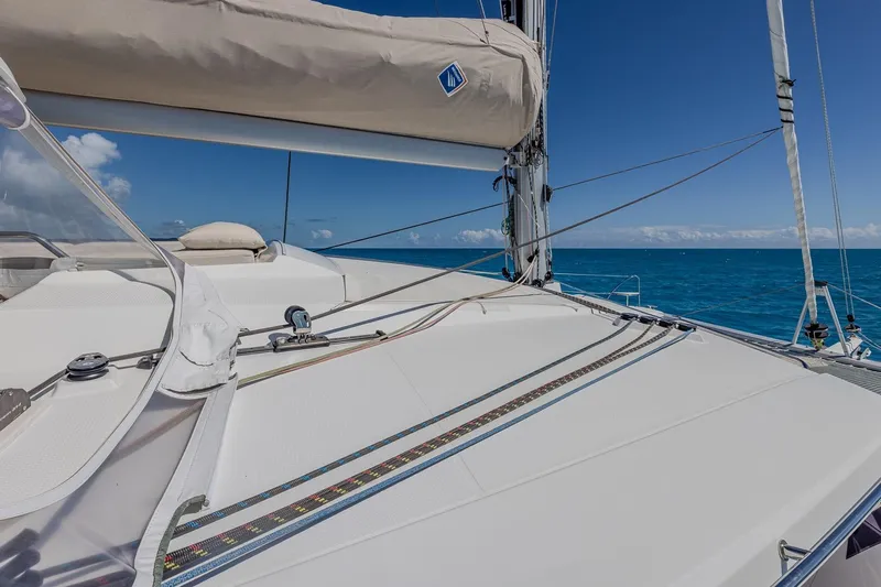 Happy Here Yacht Photos Pics 2020 Fountaine Pajot Saona 47 catamaran deck with ocean view and clear skies.