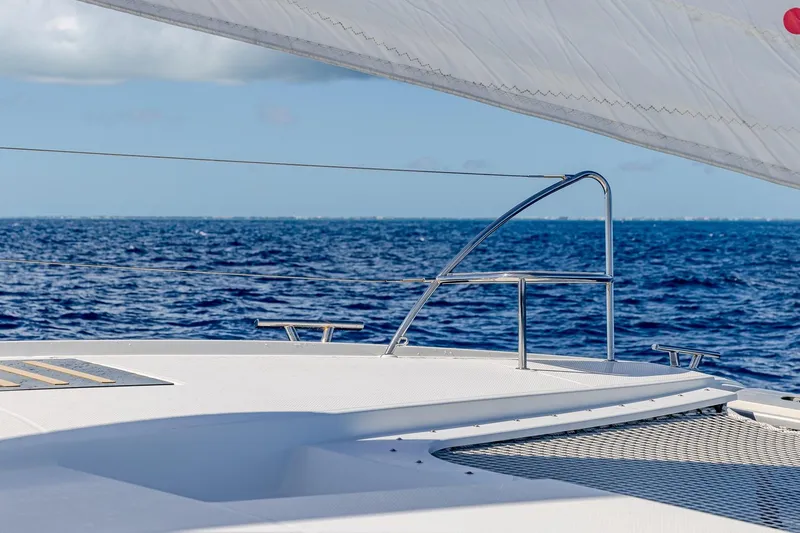 Happy Here Yacht Photos Pics Fountaine Pajot Saona 47 sailing on open sea, 2020 model, with clear blue skies.