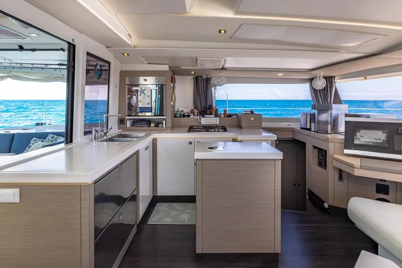 Happy Here Yacht Photos Pics Luxurious interior of 2020 Fountaine Pajot Saona 47 catamaran with ocean view.