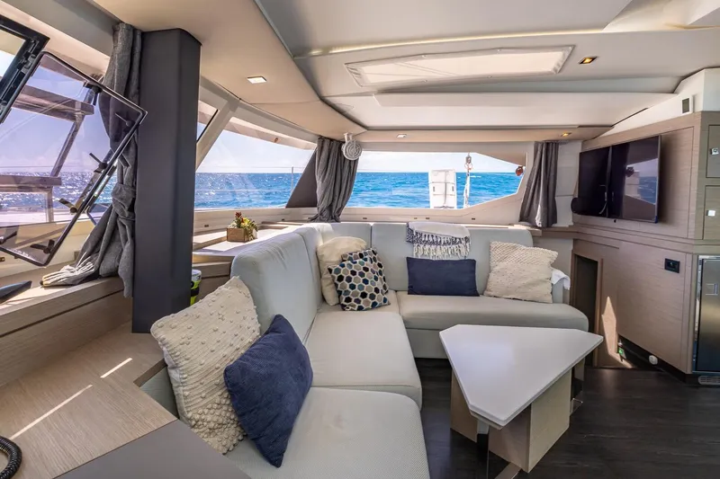 Happy Here Yacht Photos Pics Luxurious interior of 2020 Fountaine Pajot Saona 47 catamaran with ocean view.