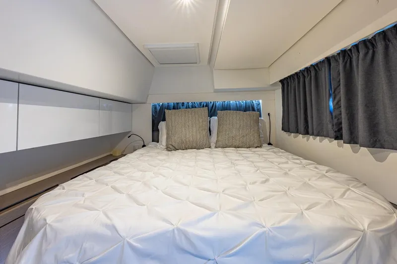 Happy Here Yacht Photos Pics Luxurious bedroom interior of 2020 Fountaine Pajot Saona 47 yacht with elegant bedding.