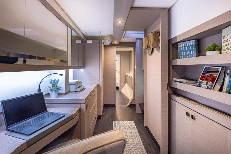 Happy Here Yacht Photos Pics Luxurious interior of 2020 Fountaine Pajot Saona 47 yacht with modern workspace and decor.