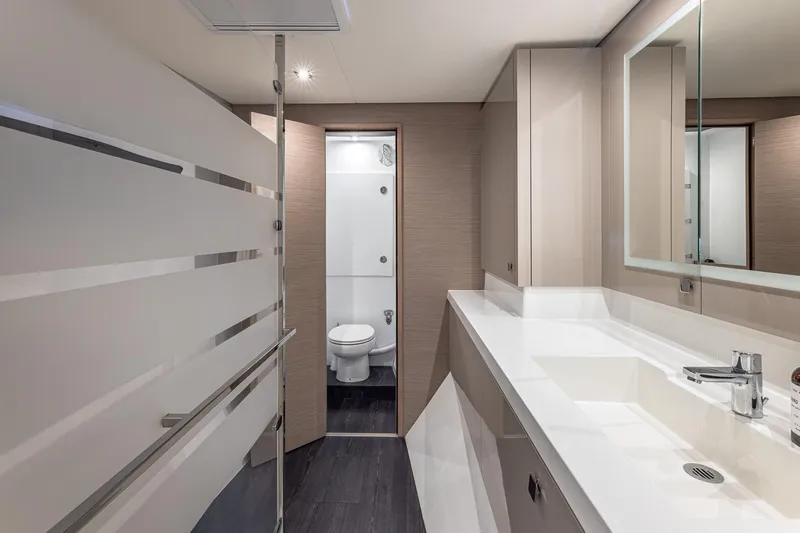 Happy Here Yacht Photos Pics Luxurious bathroom interior of 2020 Fountaine Pajot Saona 47 catamaran, featuring modern fixtures and sleek design.