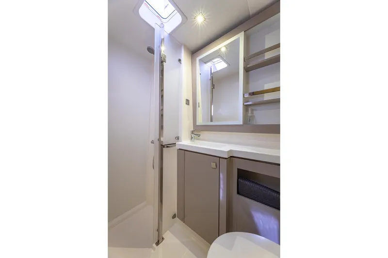 Happy Here Yacht Photos Pics Modern bathroom interior on 2020 Fountaine Pajot Saona 47 yacht, featuring sleek design and ample lighting.