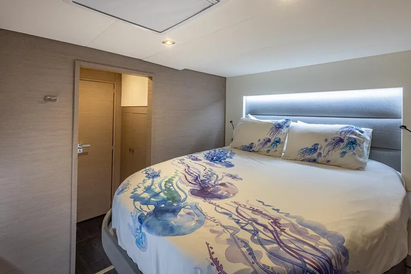Happy Here Yacht Photos Pics Luxurious bedroom interior of 2020 Fountaine Pajot Saona 47 yacht with jellyfish-themed bedding.