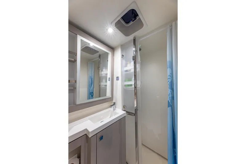 Happy Here Yacht Photos Pics Modern bathroom interior of 2020 Fountaine Pajot Saona 47 yacht, featuring sleek design and amenities.