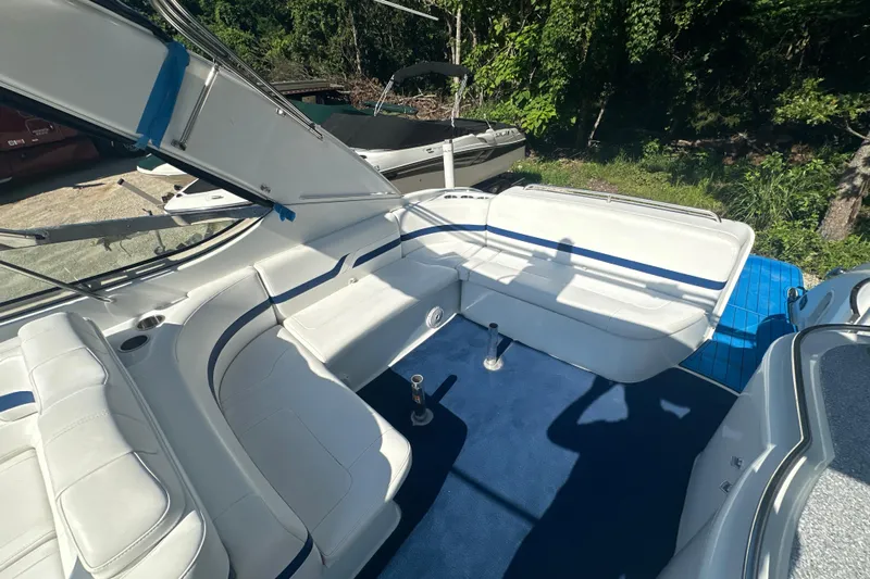  Yacht Photos Pics 2007 Formula 400 Super Sport boat interior with white seating and blue carpet.