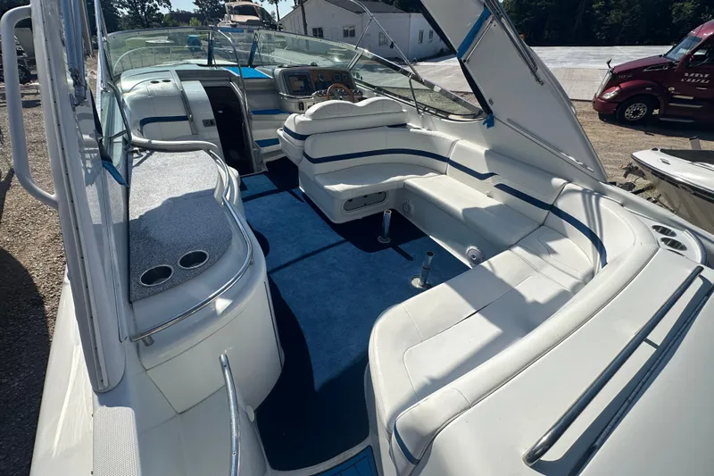  Yacht Photos Pics 2007 Formula 400 Super Sport boat interior with white seating and blue carpet.