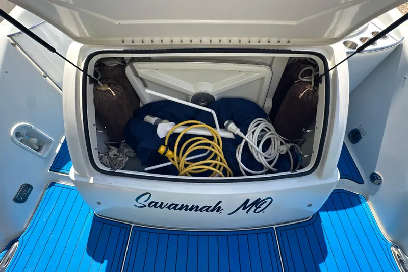  Yacht Photos Pics Open storage compartment on a 2007 Formula 400 Super Sport boat with coiled hoses.