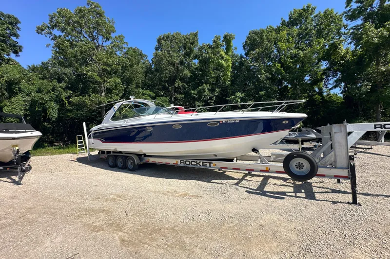  Yacht Photos Pics 2007 Formula 400 Super Sport boat on trailer, surrounded by trees.