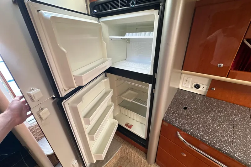  Yacht Photos Pics Open refrigerator in 2007 Formula 400 Super Sport boat kitchen interior.