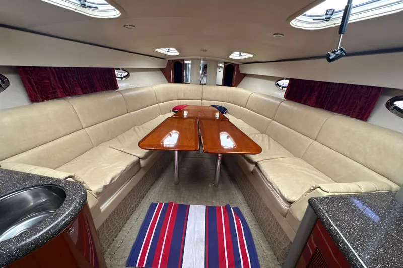  Yacht Photos Pics Luxurious interior of a 2007 Formula 400 Super Sport yacht with beige seating and wooden table.