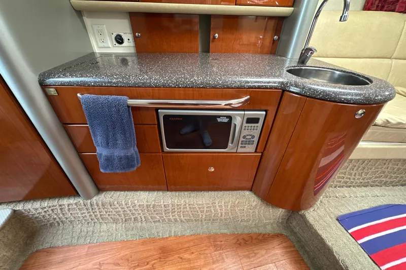  Yacht Photos Pics 2007 Formula 400 Super Sport yacht interior with kitchenette, featuring microwave and sink.