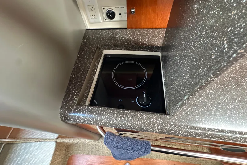  Yacht Photos Pics 2007 Formula 400 Super Sport yacht kitchen with sleek black cooktop and granite countertop.