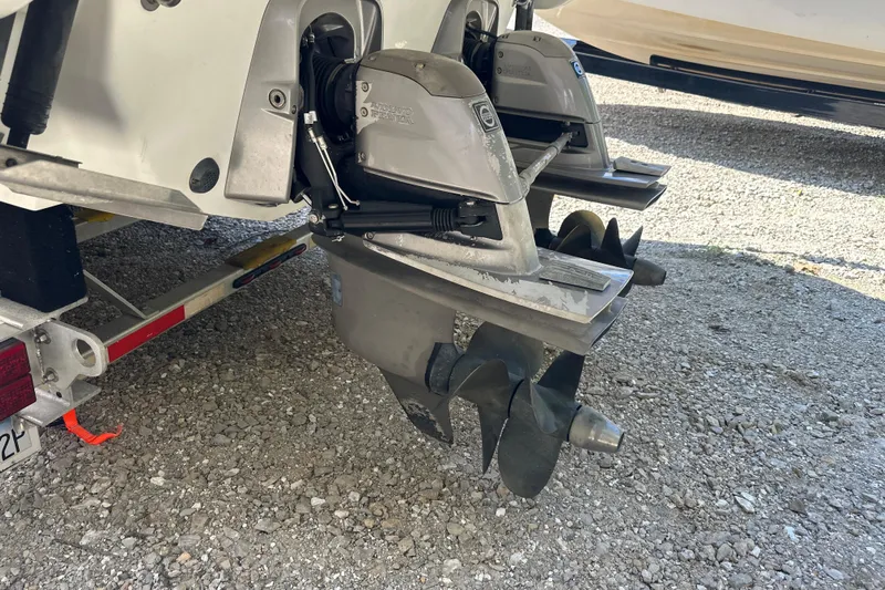  Yacht Photos Pics 2007 Formula 400 Super Sport boat propellers on a trailer, parked on gravel.
