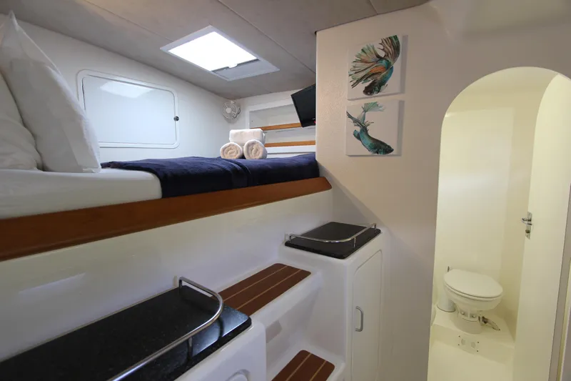 Osprey Yacht Photos Pics Cabin interior of 2011 Voyage Yachts VOYAGE 520 with bunk bed and bathroom.